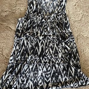 2 Tanktops with one solid black and one black and white design!